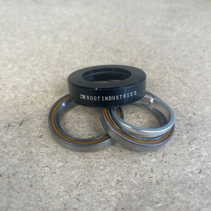 Exploded metal bearings on a concrete surface